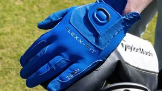 Man wears Zoom Weather glove showing off its cool blue colorway