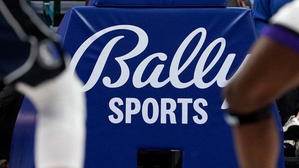 A Bally Sports sign below the basket at American Airlines Center, home of the NBA’s Dallas Mavericks.