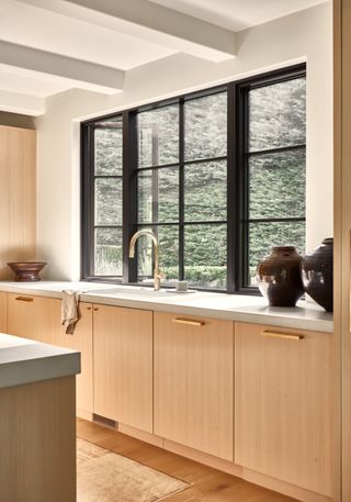 Wooden kitchen with large kitchen window