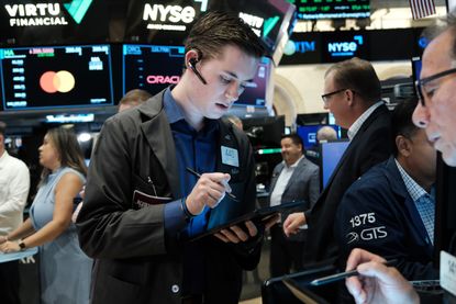 A trader working on the New York Stock Exchange floor