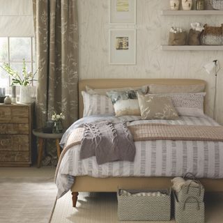 Neutral bedroom with botanical print on wallpaper and curtains