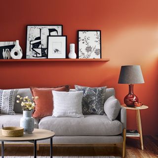 Red living room with picture rail and grey sofa