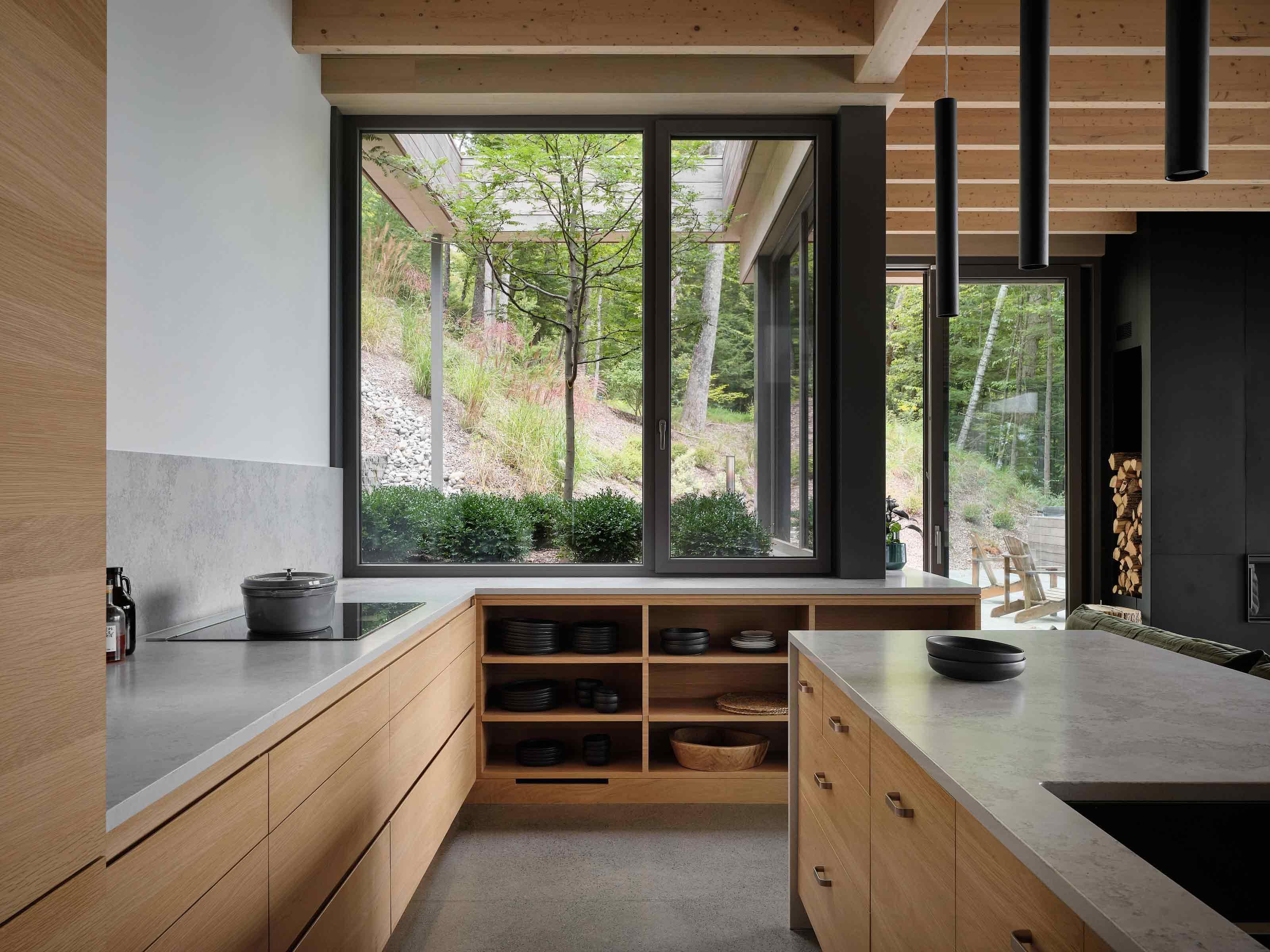 The kitchen and living area feels embedded in the hillside
