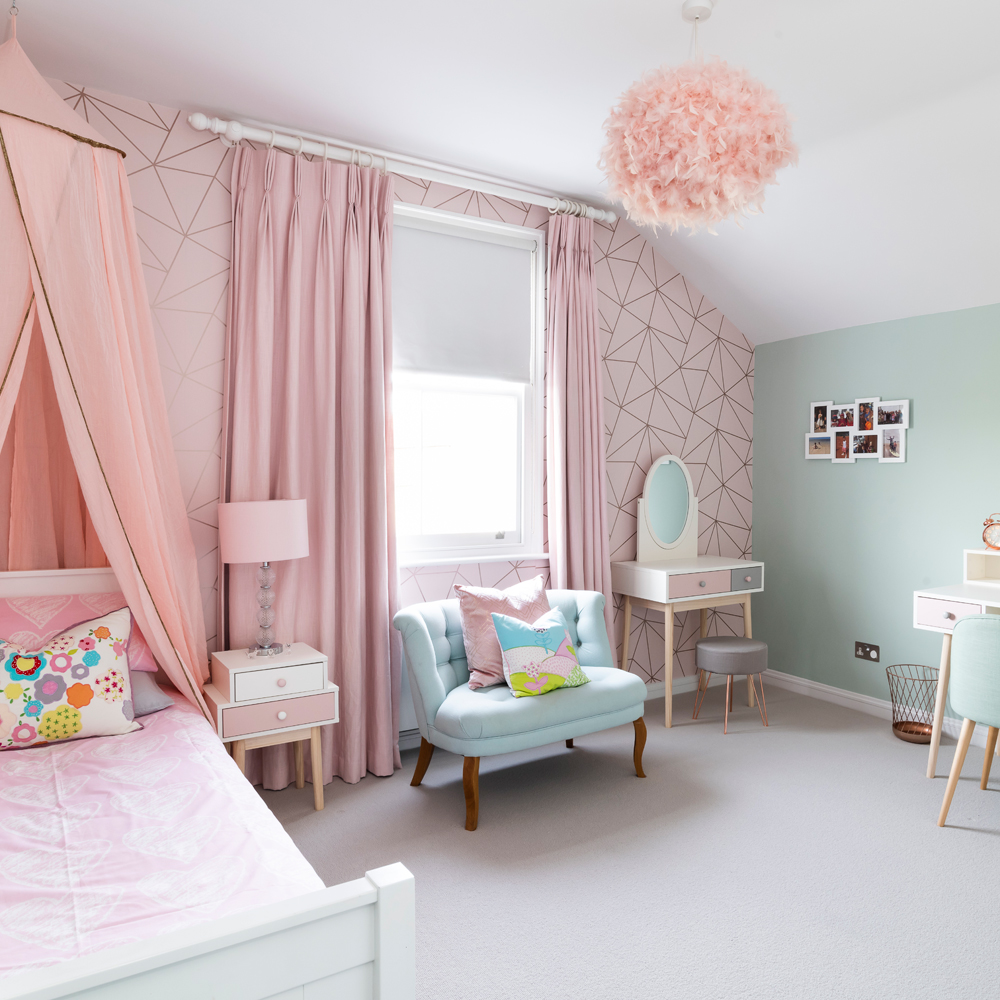 girls bedroom with bed and pink curtains