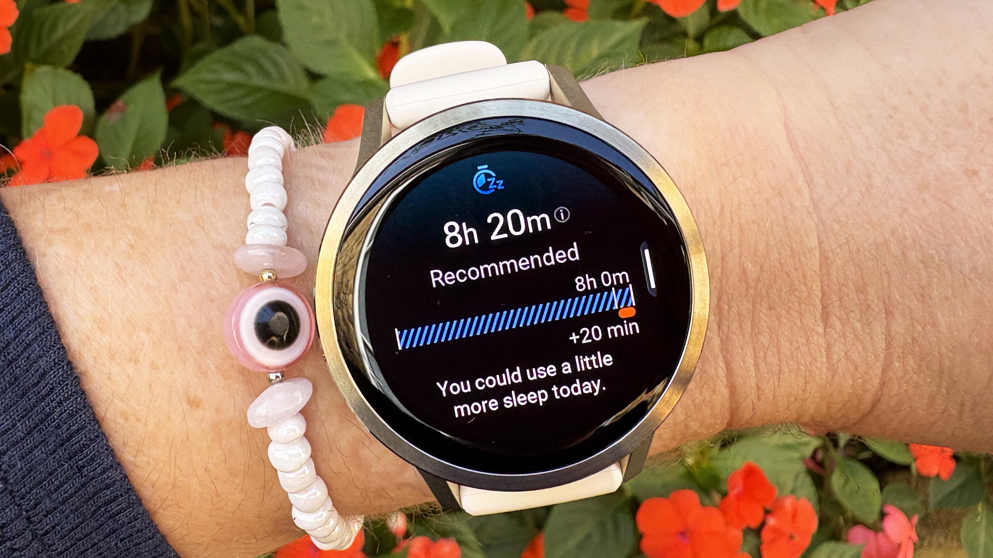 the Garmin Venu 4 in lunar gold on the wrist