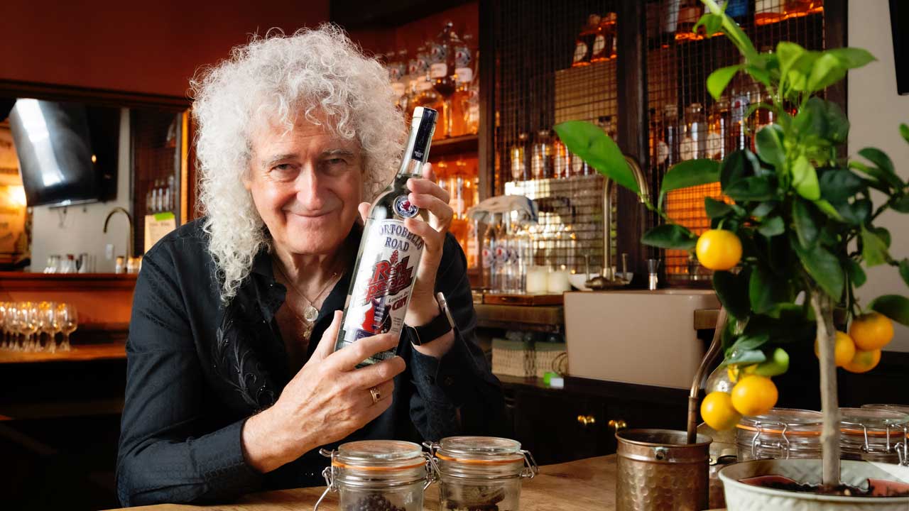 Brian May with a bottle of Red Special gin