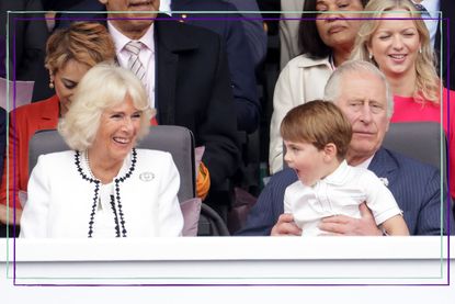 King Charles III and Camilla Queen Consort with Prince Louis sat on his grandpa's knee at the Queen's Platinum Jubilee