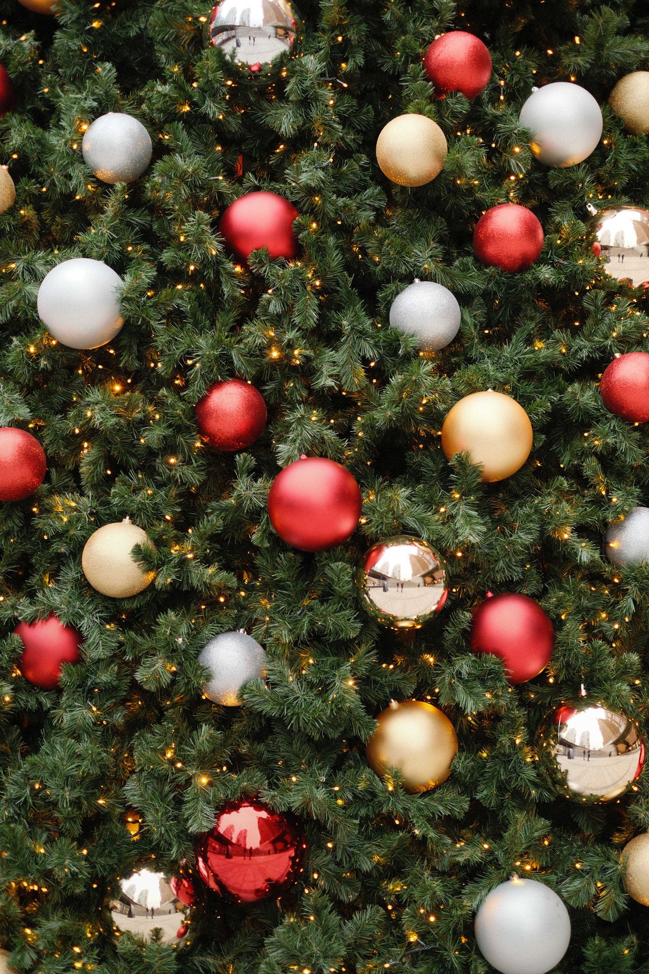 Close up of a Christmas tree covered in baubles