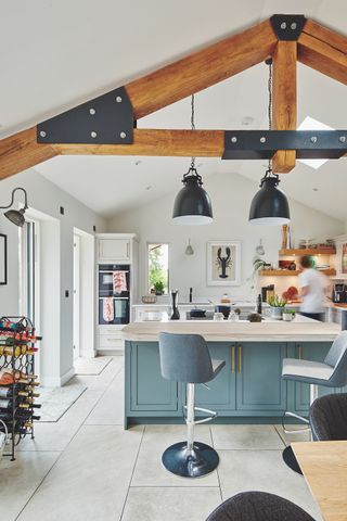 large vaulted kitchen with statement pendent lights