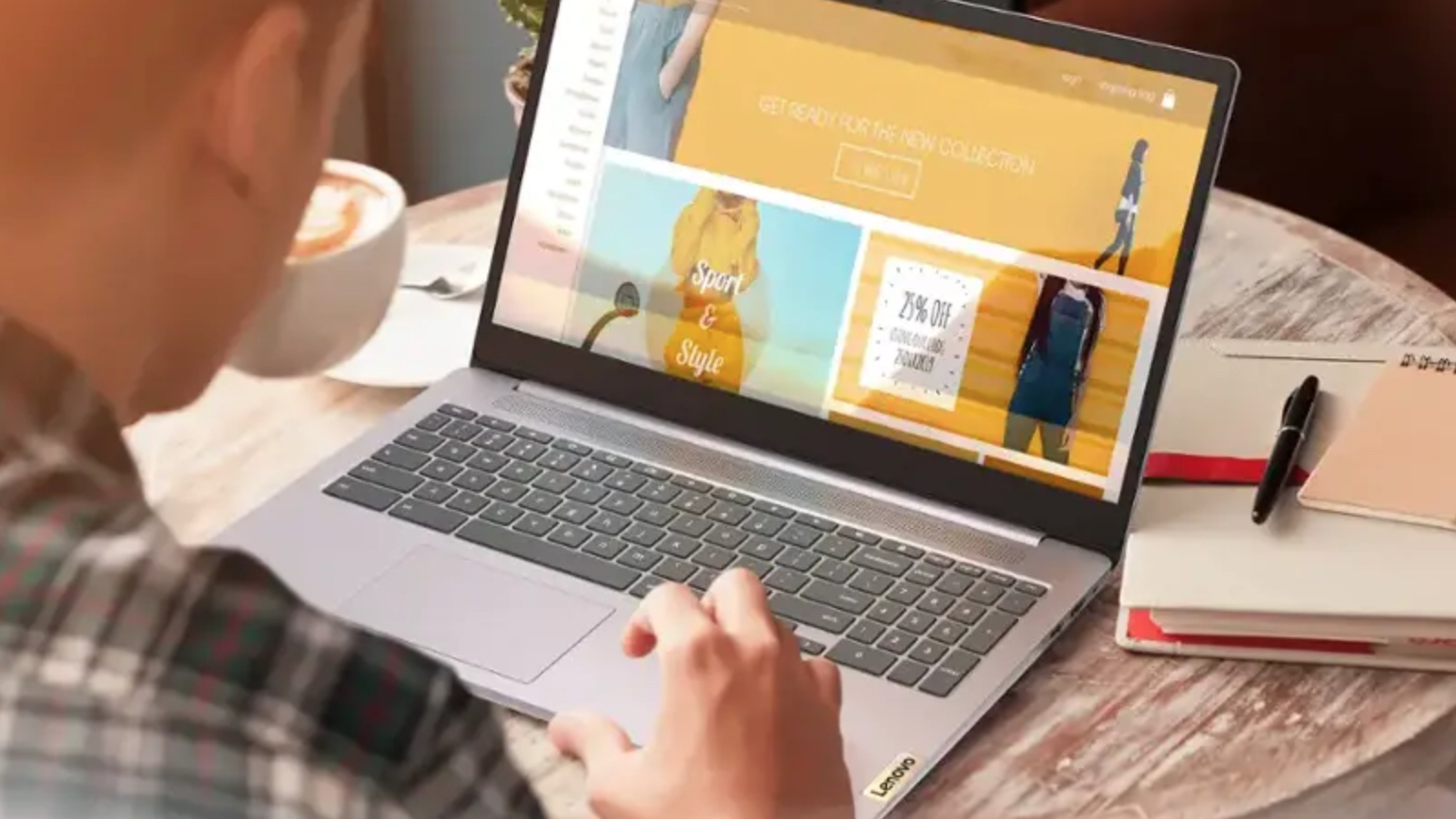 A person on a Lenovo laptop