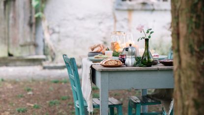 outdoor table laid with food in italian village