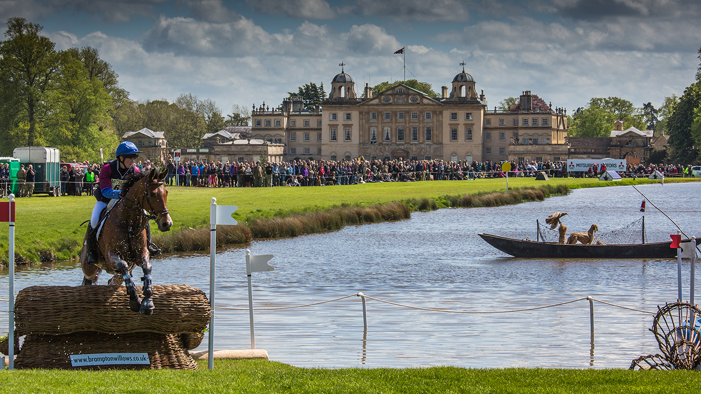 Hannah Bate and Finbury Hill jumping through The Lake at Badminton 2015