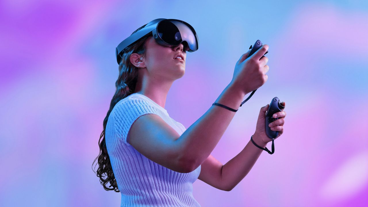 Meta Quest Pro VR headset being worn by a woman in a white short sleeve