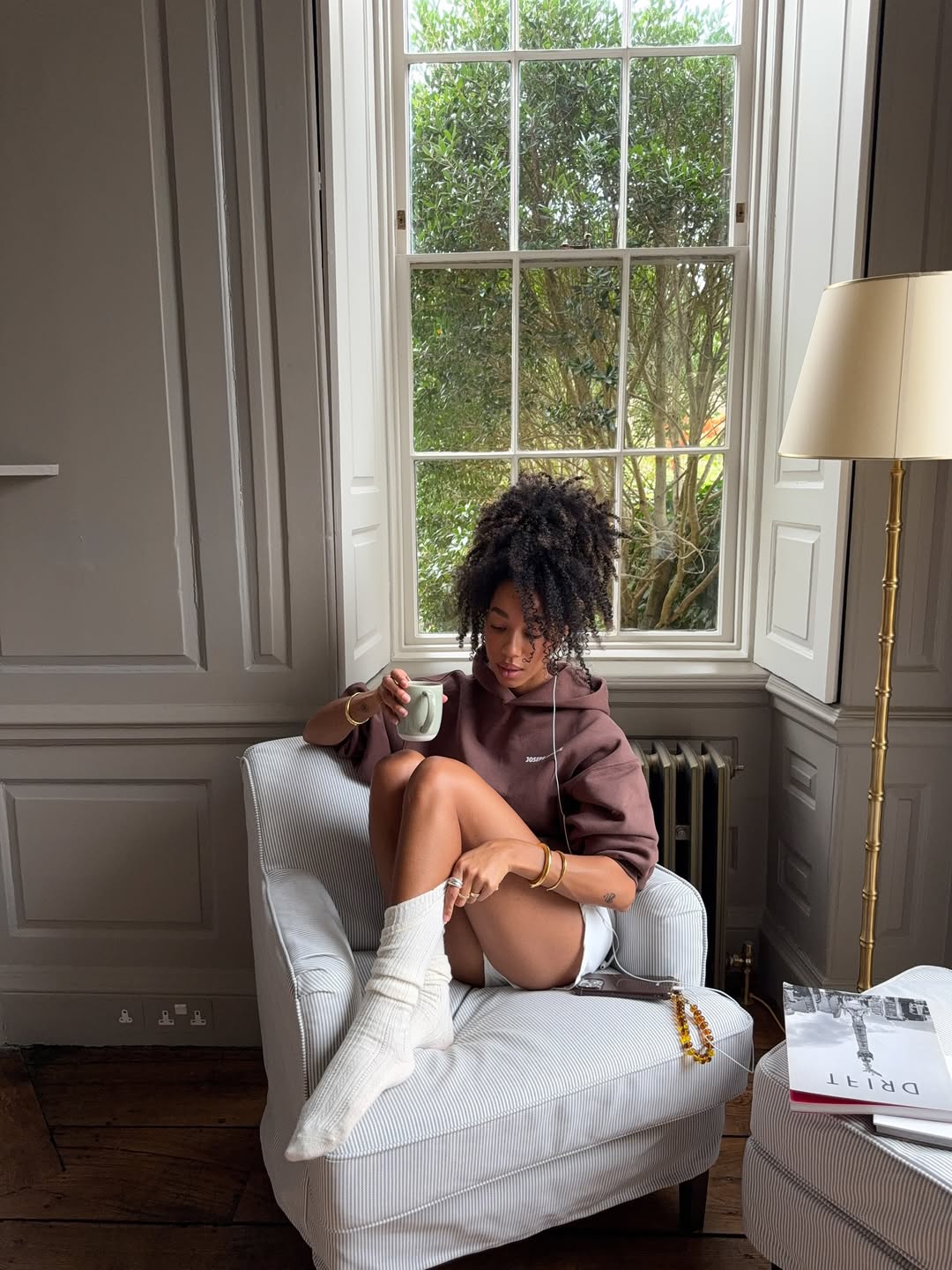 Amaka Hamelijnck with defined curls pulled into a bun