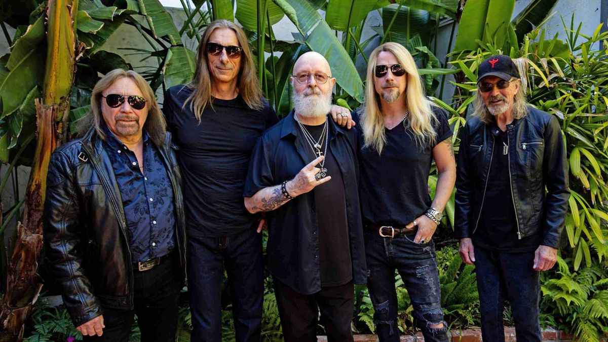 Judas Priest next to some shrubbery