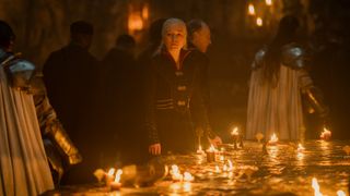 Rhaenyra Targaryen (Emma D'Arcy) stands at the candlelit war table in episode 10 of House of the Dragon