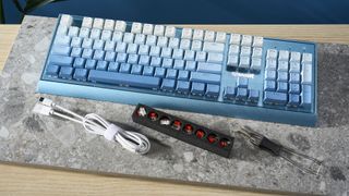 A Redragon Blue Siren K654 wired mechanical keyboard with multi-tone blue keycaps