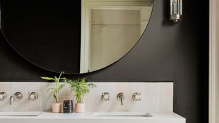A bathroom painted in dark shades to illustrate paint color ideas for bathrooms