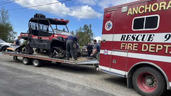 An image from The Anchorage Fire Department shows a fire truck towing a 4X4 used to extract the victim of a bear mauling on July 22, 2025