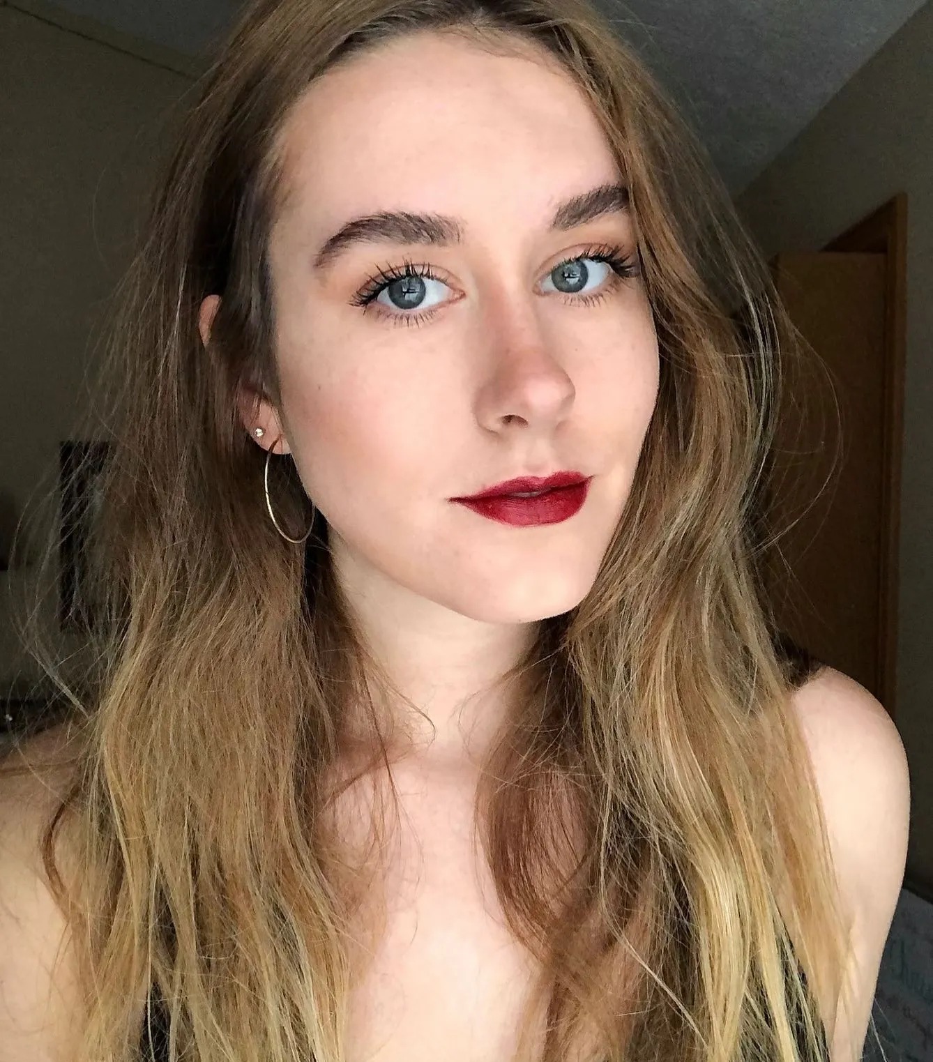 An image of WWW editor Kaitlyn McLintock wearing Milani's Color Statement Lipstick in Matte Confidence.