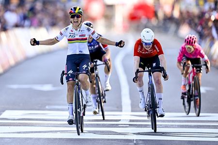 Mauritius' AG Soudal Team's Kim Le Court (L) celebrates after winning the women elite race of the Liege-Bastogne-Liege one day cycling event, 152,9km from Bastogne to Liege, on April 27, 2025. (Photo by ERIC LALMAND / Belga / AFP) / Belgium OUT