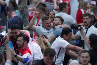 Fans in BoxPark Croydon celebrate Harry Maguire’s goal