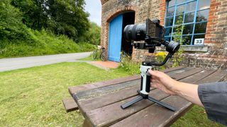 Zhiyun Cinepeer Weebill 3E gimbal close up being operated by a person's hand