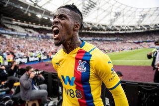 Wilfried Zaha of Crystal Palace celebrate after hes team score 2nd goal during the Premier League match between West Ham United and Crystal Palace at London Stadium on August 28, 2021 in London, England.