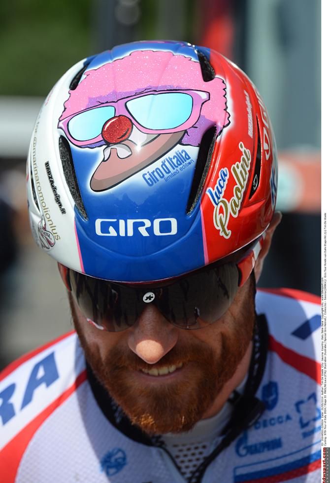 Luca Paolini's helmet is painted in support of fellow Italian Marina Romoli who was paralyzed in a training crash