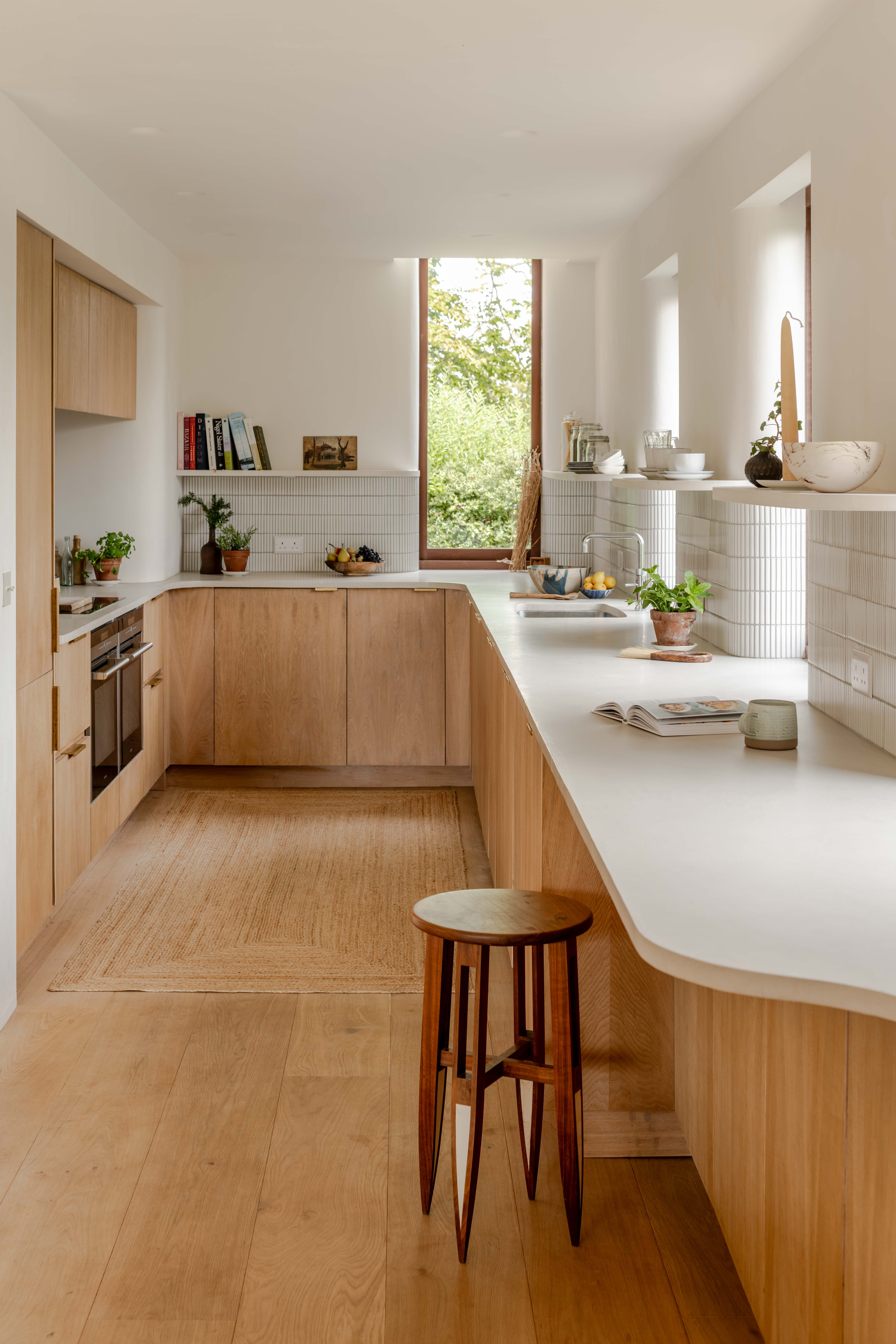 image of Clay Rise by Templeton Ford, a brick house with a curved roof in west sussex countryside
