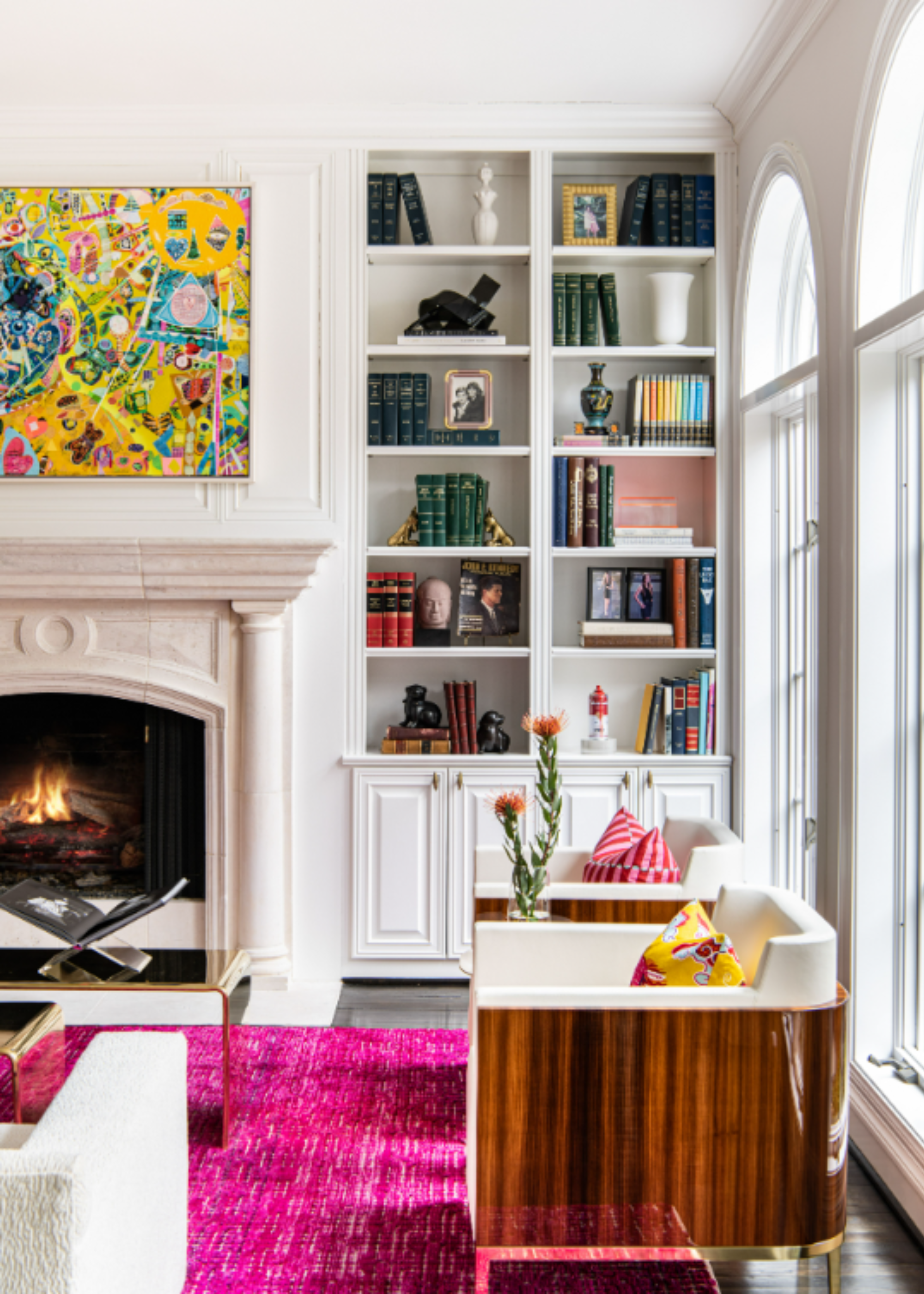 A living room with a bookshelf with architectural millwork