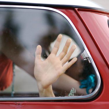 couple kissing in a car