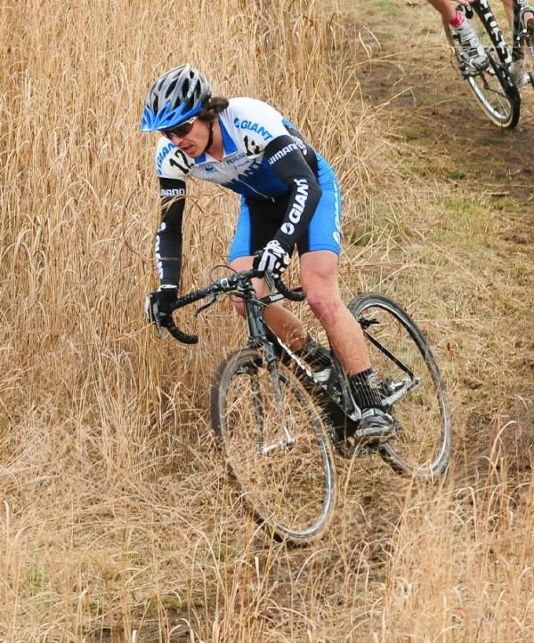 Adam Craig (Team Giant) descending through tall grass