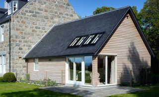 Wood cladding on extension