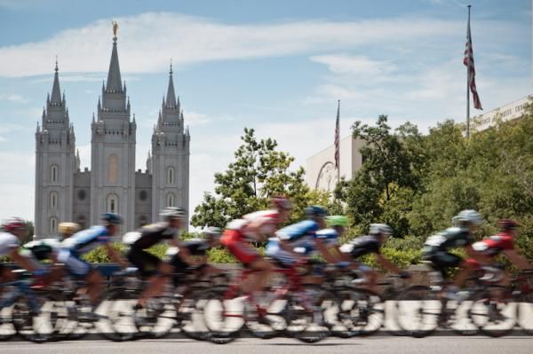 Riders pass by the famous Mormon Temple landmark.