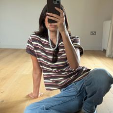 influencer Marianne Smyth wearing a retro striped tee with jeans