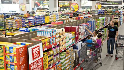 Shoppers browse items on display for sale at an Aldi Stores Ltd. food market in Chicago, Illinois