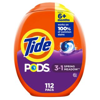 An orange and purple plastic pot of laundry pods