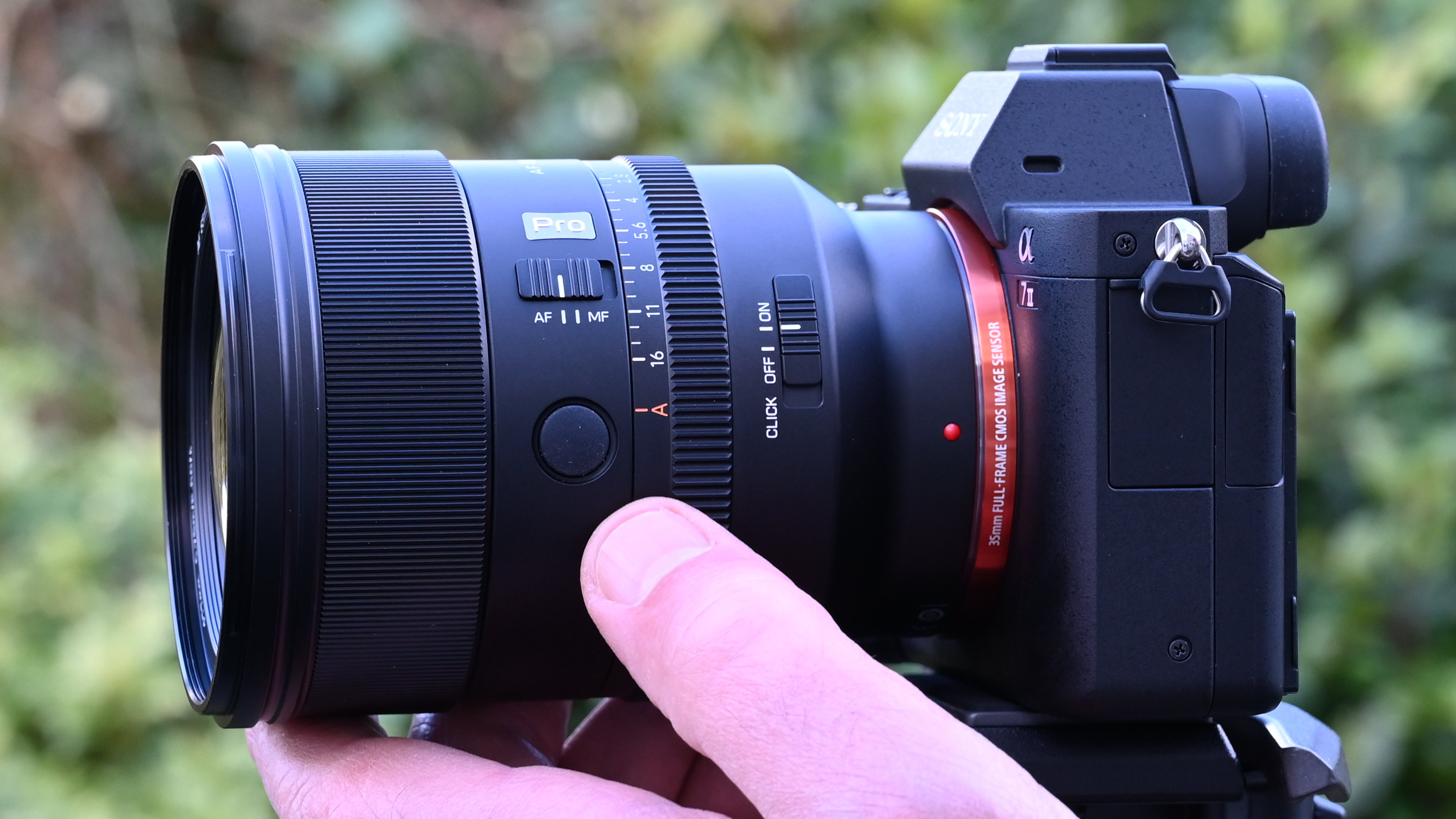 Viltrox AF 85mm f/1.4 Pro product shot, lens in hand