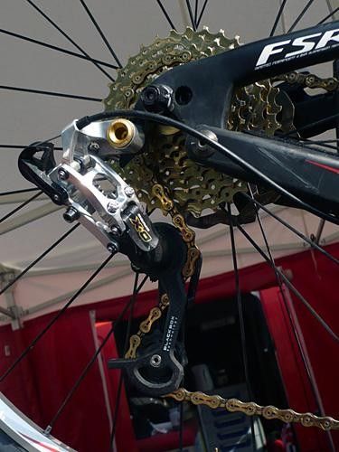 A SRAM X.0 rear derailleur is mated to an ultralight KMC chain and a TiN-coated cassette.