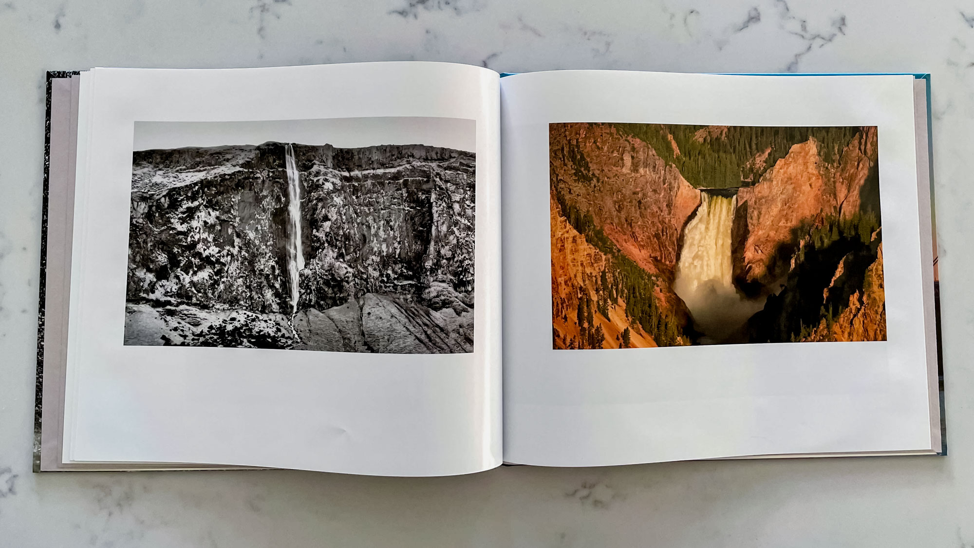 A Blurb photo book open on a countertop surface