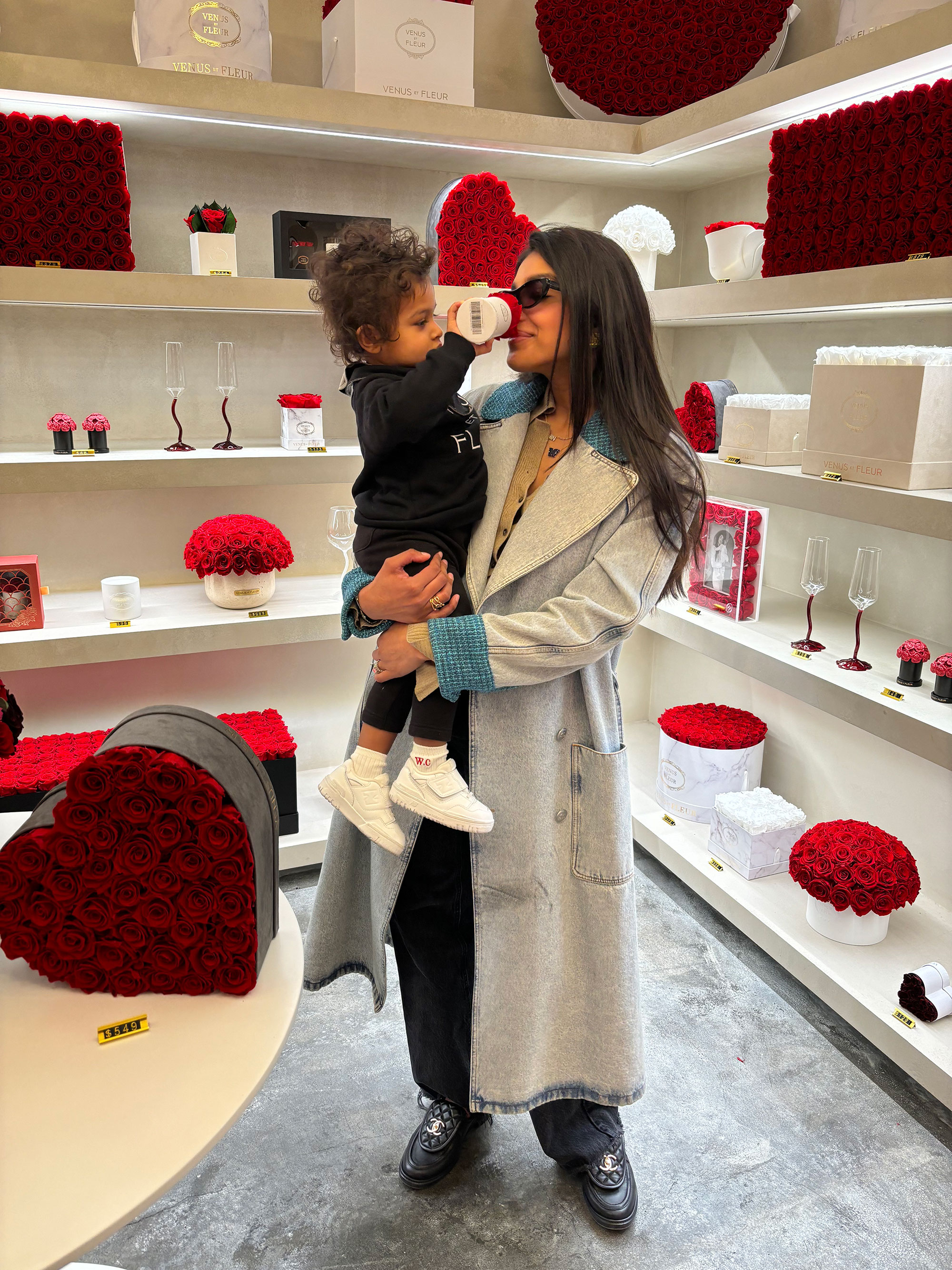 Seema Bansal Chadha with her son in her flower shop.