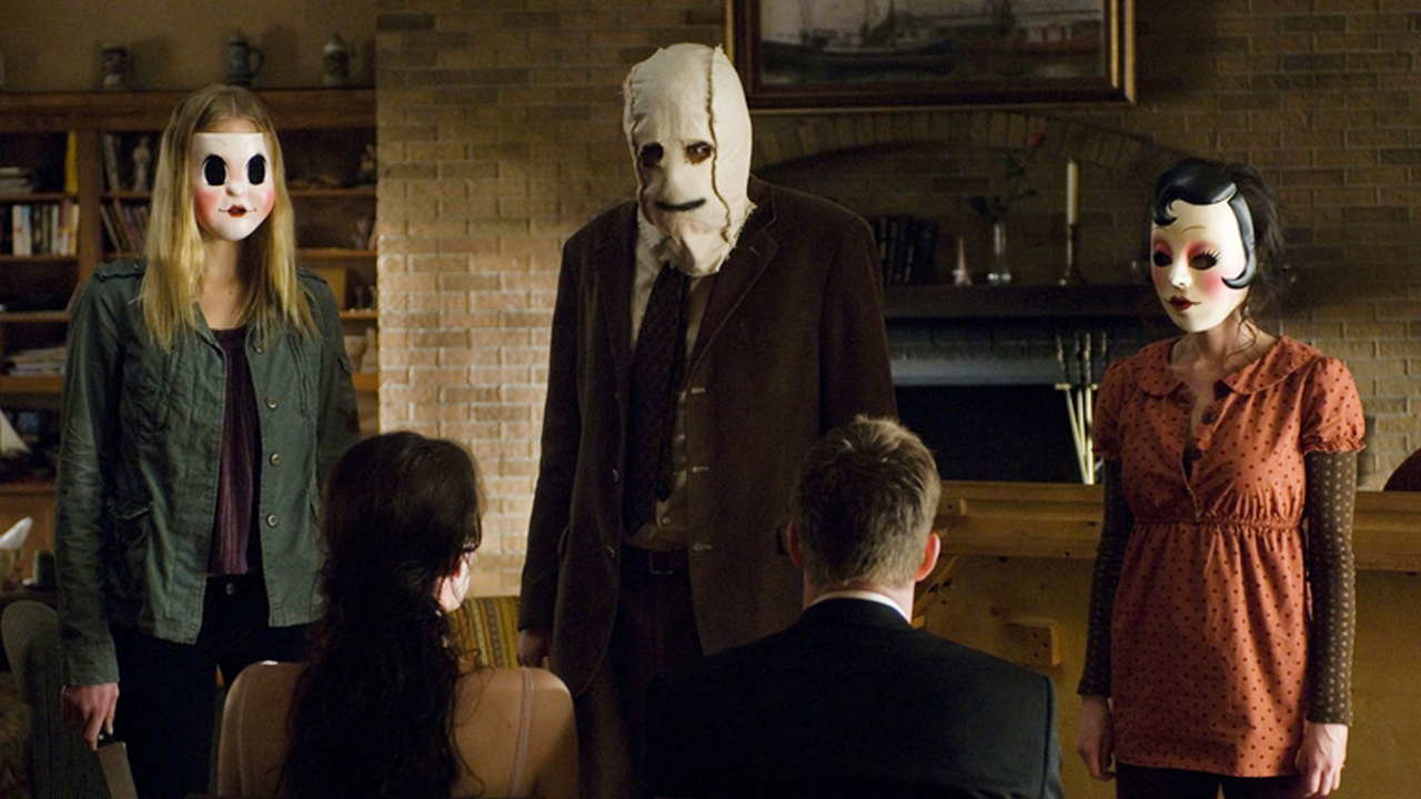 Three masked strangers terrorize a couple in The Strangers