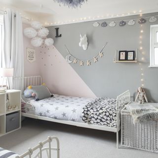 grey and pink kids bedroom with bed