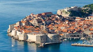 Town, Sea, Coast, Azure, Tourism, Promontory, Village, Harbor, Vacation, Coastal and oceanic landforms,