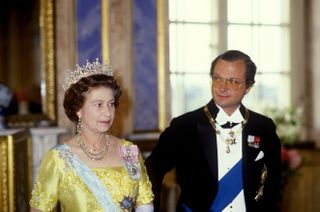 Queen Elizabeth II, Sweden, Queen Elizabeth ll attends the State Banquet given in her honour by King Carl XVl Gustaf and Queen Silvia of Sweden in Stockholm, Sweden, Queen Elizabeth wears The Girls of Great Britain and Ireland Tiara, theGreville Chandelier Earrings, the George VI Festoon Necklace