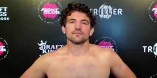 Ben Askren answering questions with a shirt on after his match with Jake Paul.