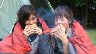 Kids eating at the campsite