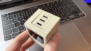 The Shargeek Retro 67 charger on a desk, which looks like a mini Macintosh computer.