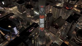 Sky Tower in Auckland with a projection of Ozzy Osbourne